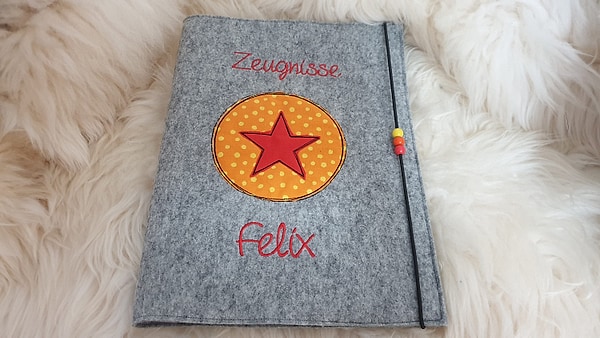 Zeugnismappe Stern im Kreis orange Dots rot mit Namen W100